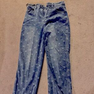 Never worn Chanel bootleg jeans with fantastic double C distressing